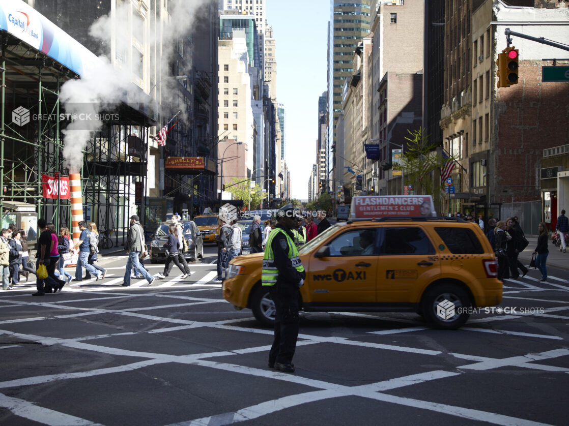 Busy Crosswalk and Intersection in Manhattan, New York City