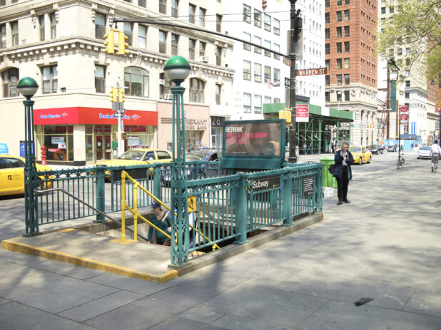 Green Staircase Subway Entrance with Subway Globe Lamp Posts in Manhattan, New York City
