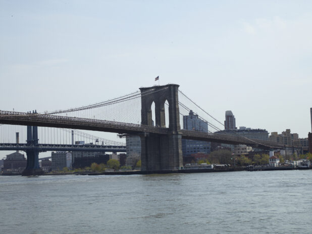 Across-the-River View of a Suspension Tower for Brooklyn Bridge in Manhattan, New York City