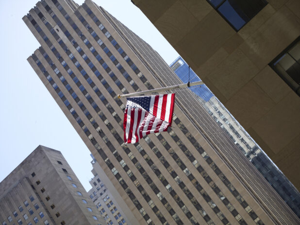 American Flag Hanging From the Side of a Building in Manhattan, New York City