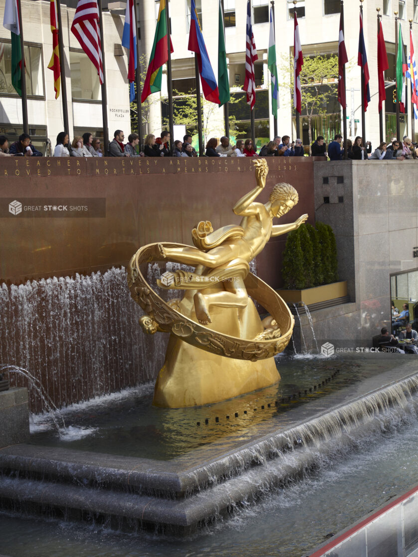 Portrait View of the Water Fountain Featuring the Sculpture of Prometheus in the Lower Plaza of the Rockefeller Center in Manhattan, New York City