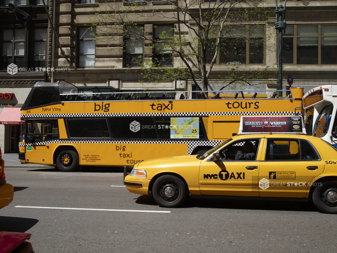 A Yellow NYC Taxi Cab Beside a Yellow Double Decker Sightseeing Tour Bus in Manhattan, New York City