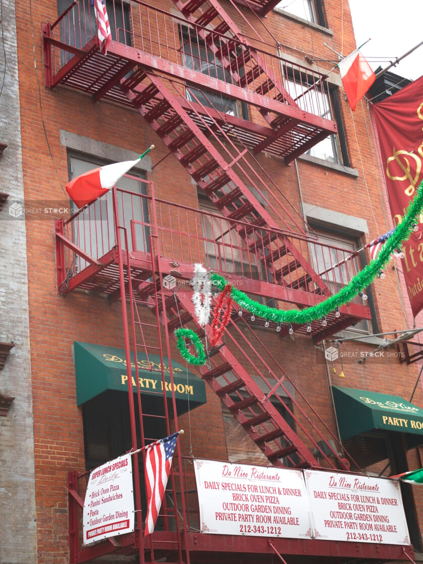 Red Brick Exterior of De Nico Ristorante and Its Red Painted Emergency Fire Escape Stairs in Manhattan, New York City