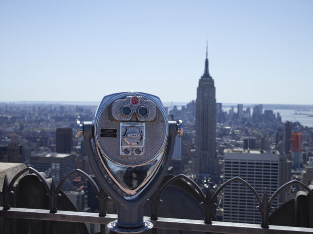 Coin-Operated Binoculars on the Viewing Platform at the Top of Rockefeller Center with the Empire State Building in the Background in New York City