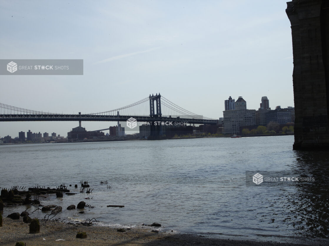 Across-the-Lake View of Manhattan Bridge From the Shore of the East River in Manhattan, New York City