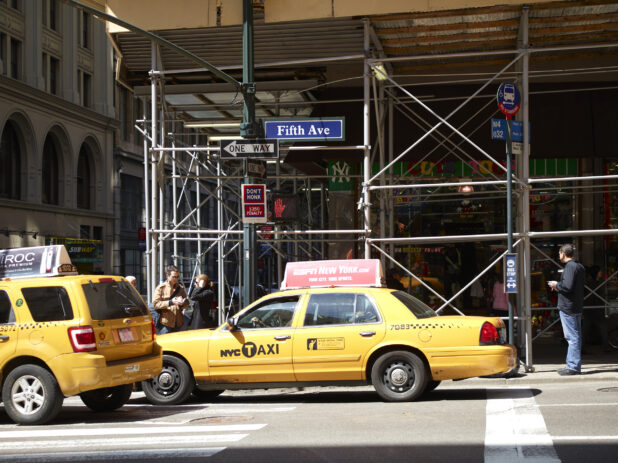 Yellow NYC Taxi Cabs on Fifth Avenue in Manhattan, New York City