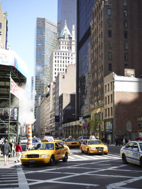 Sixth Avenue with Yellow NYC Taxicabs and the Crown Building in Manhattan, New York City