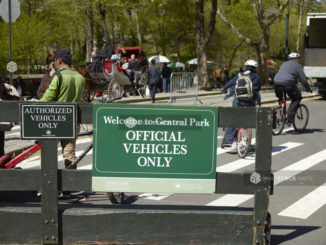 Vehicle Restriction Signage on a Wooden Gate in Front of Central Park in Manhattan, New York City