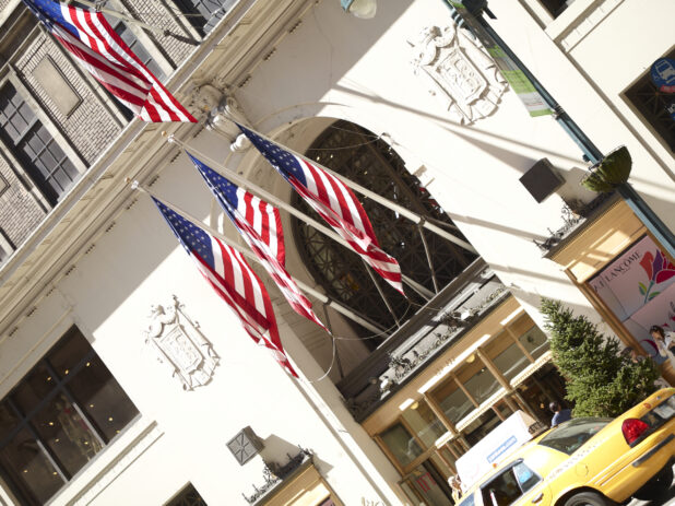 American Flags Hanging Over the Entrance to the Lord and Taylor Department Store (Closed) in Manhattan, New York City