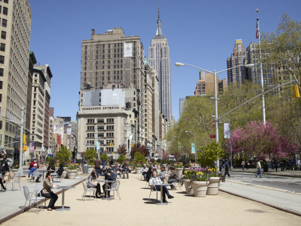 Public Space and Street Level View Down Fifth Avenue Towards Empire State Building in Manhattan, New York City