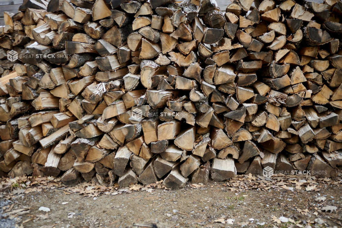 Close Up of Logs for Wood-Burning Stoves Piled High for Winter in Cottage Country, Ontario, Canada