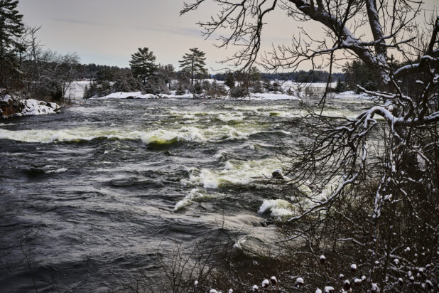 View of a River with Choppy Waters After a Winter Storm in Cottage Country, Ontario, Canada