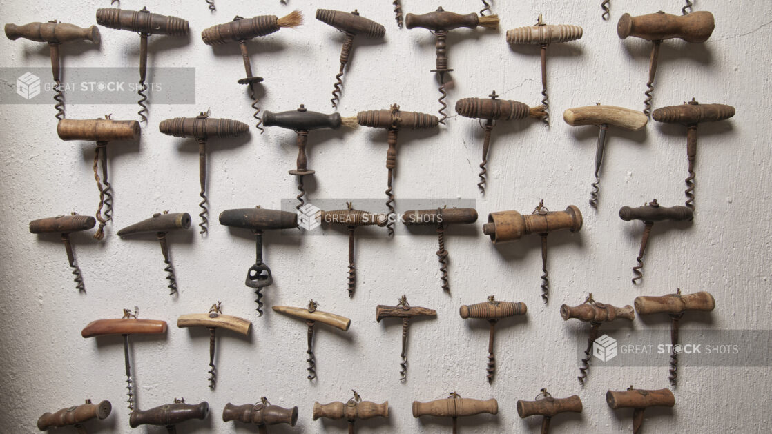 Antique Corkscrews and Wine Bottle Openers Alined on a Wall in the Wine Museum of Ristorante Pagnanelli in Castel Gandolfo, Italy - Variation