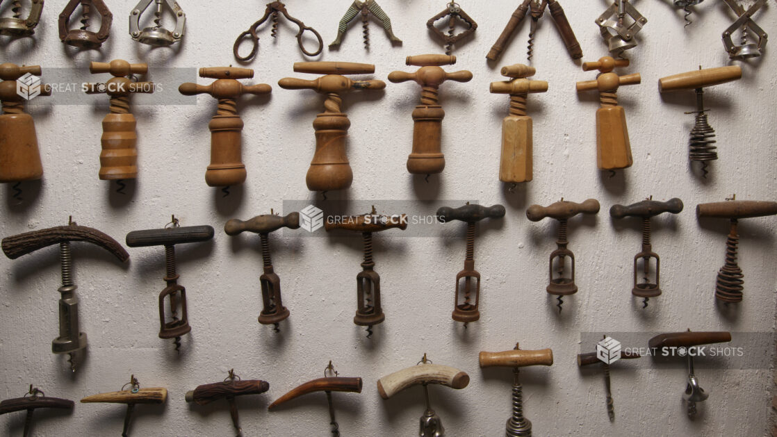 Antique Corkscrews and Wine Bottle Openers Alined on a Wall in the Wine Museum of Ristorante Pagnanelli in Castel Gandolfo, Italy