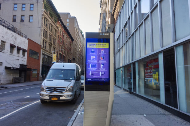 Close Up of a LinkNYC Kiosk Showing Social Distancing Messages in an Empty City Street During Lockdown in Manhattan, New York City