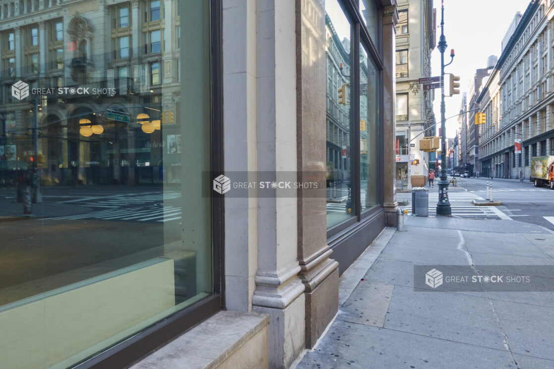 View Along a Vacant Storefront and Deserted Sidewalk and Street in Manhattan, New York City During Lockdown