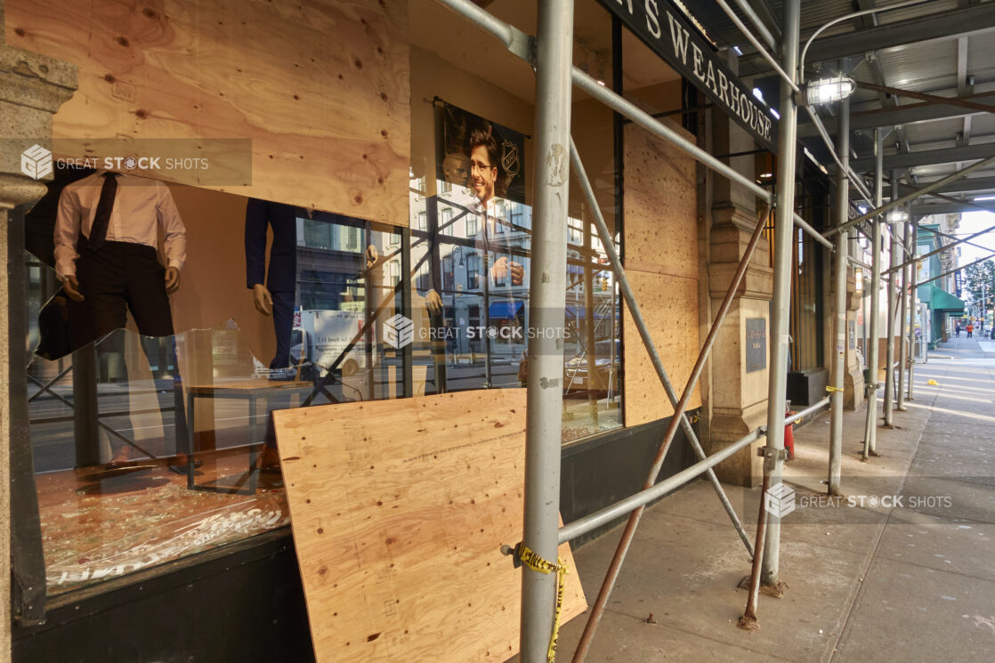 Windows of a Retail Store Being Boarded Up After Vandalism/Looting in Manhattan, New York City During Lockdown