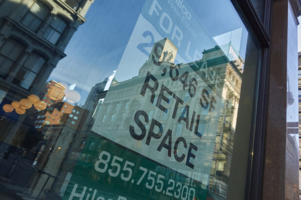 A For Lease Sign in a Store Window During Lockdown in New York City