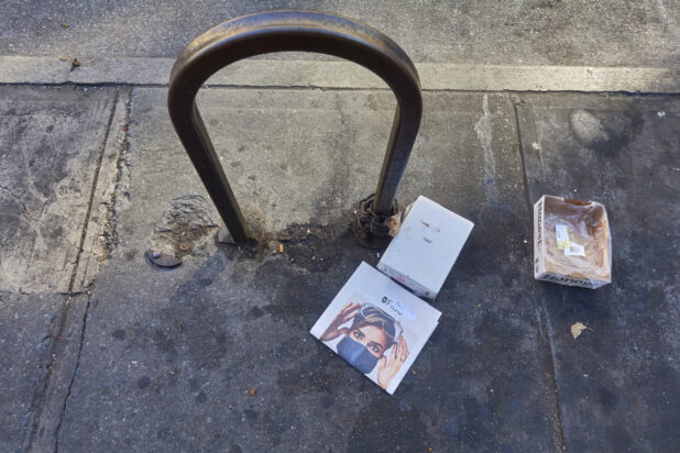 View of a Bike Rack and Sidewalk Littered with Cardboard Boxes During Lockdown in New York City