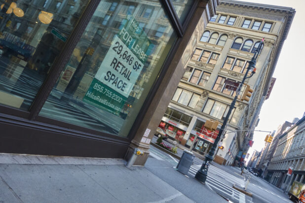 View of a Deserted Street Corner with a Vacant Retail Store in Manhattan, New York City During Lockdown