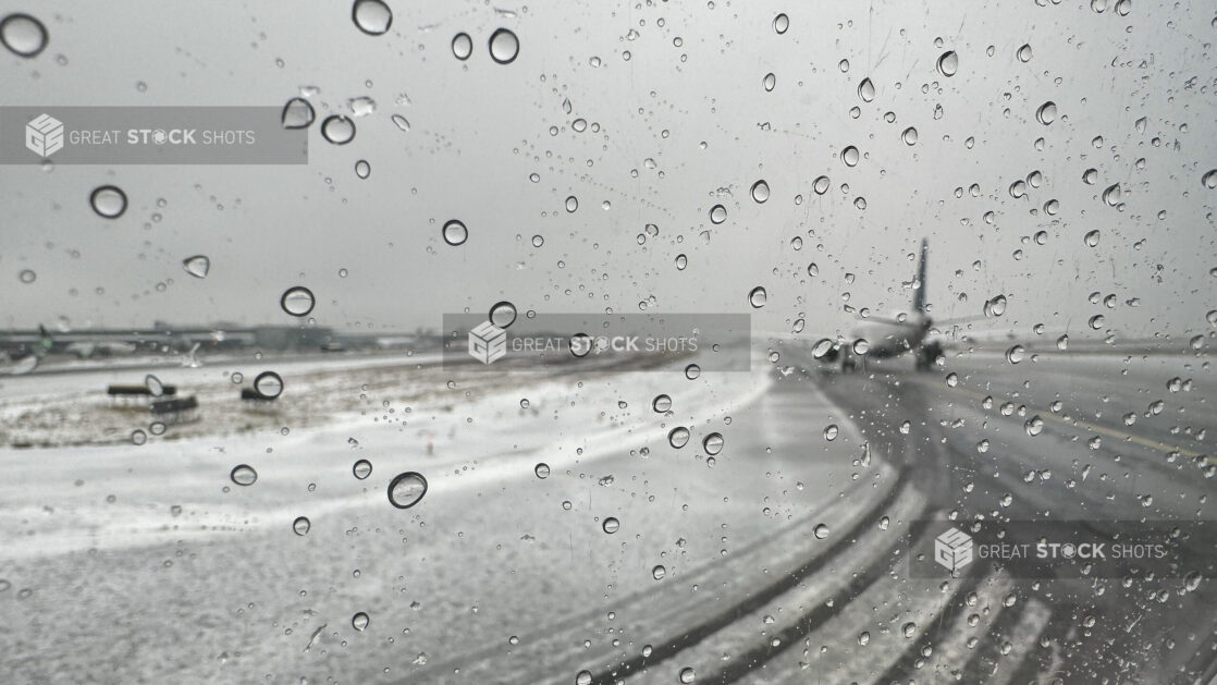 View From a Window Out to an Airport Runway During Bad Winter Weather - Variation