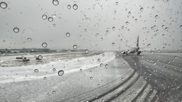 View From a Window Out to an Airport Runway During Bad Winter Weather - Variation