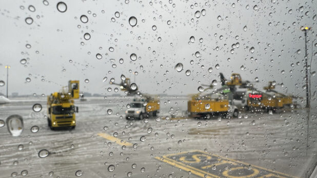 View From a Window Out to an Airport Runway During Bad Winter Weather – Variation 2