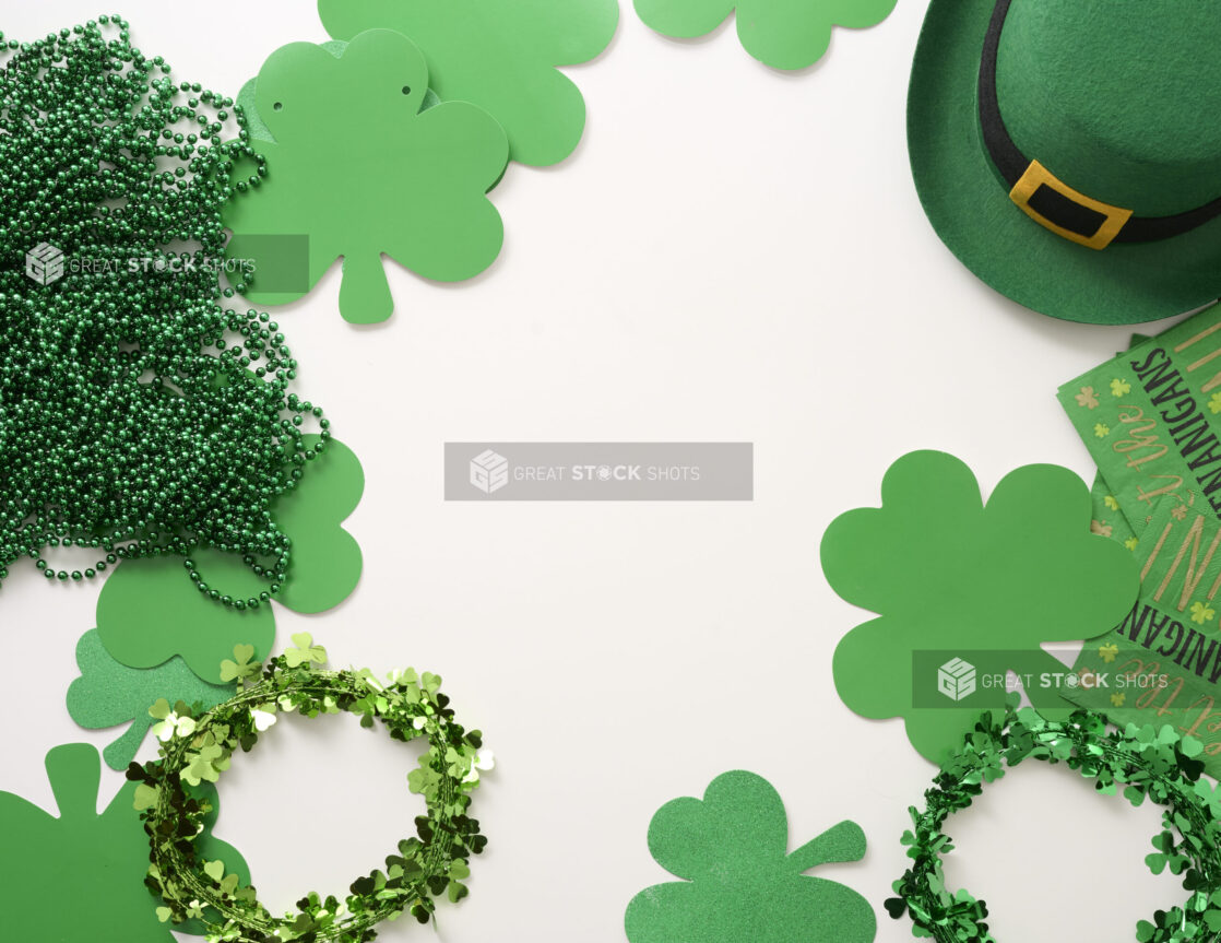 Overhead View of an Assortment of St. Patrick’s Day Decorations – Shamrock Wreaths, Leprechaun Hat, Green Clover Clings and Green Beads