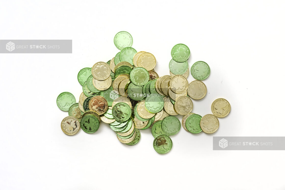 A Pile of Green and Gold Leprechaun Coins for St. Patrick's Day Decorations, Shot on White for Isolation