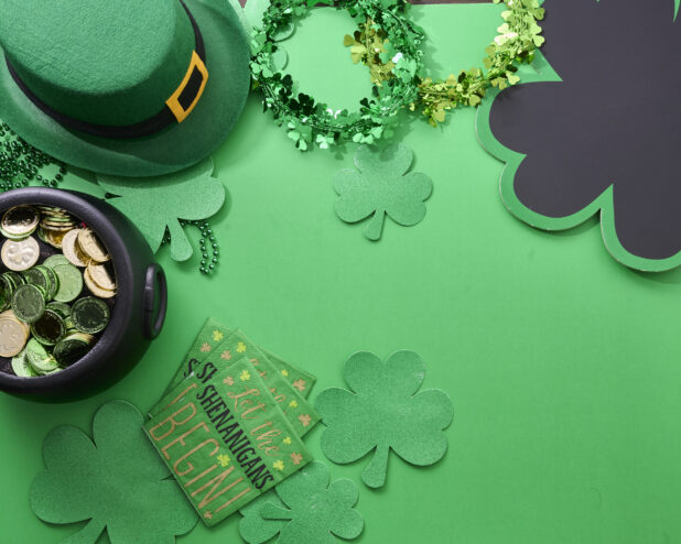 Overhead View of Assorted St. Patrick’s Day Decorations on a Green Background - Variation