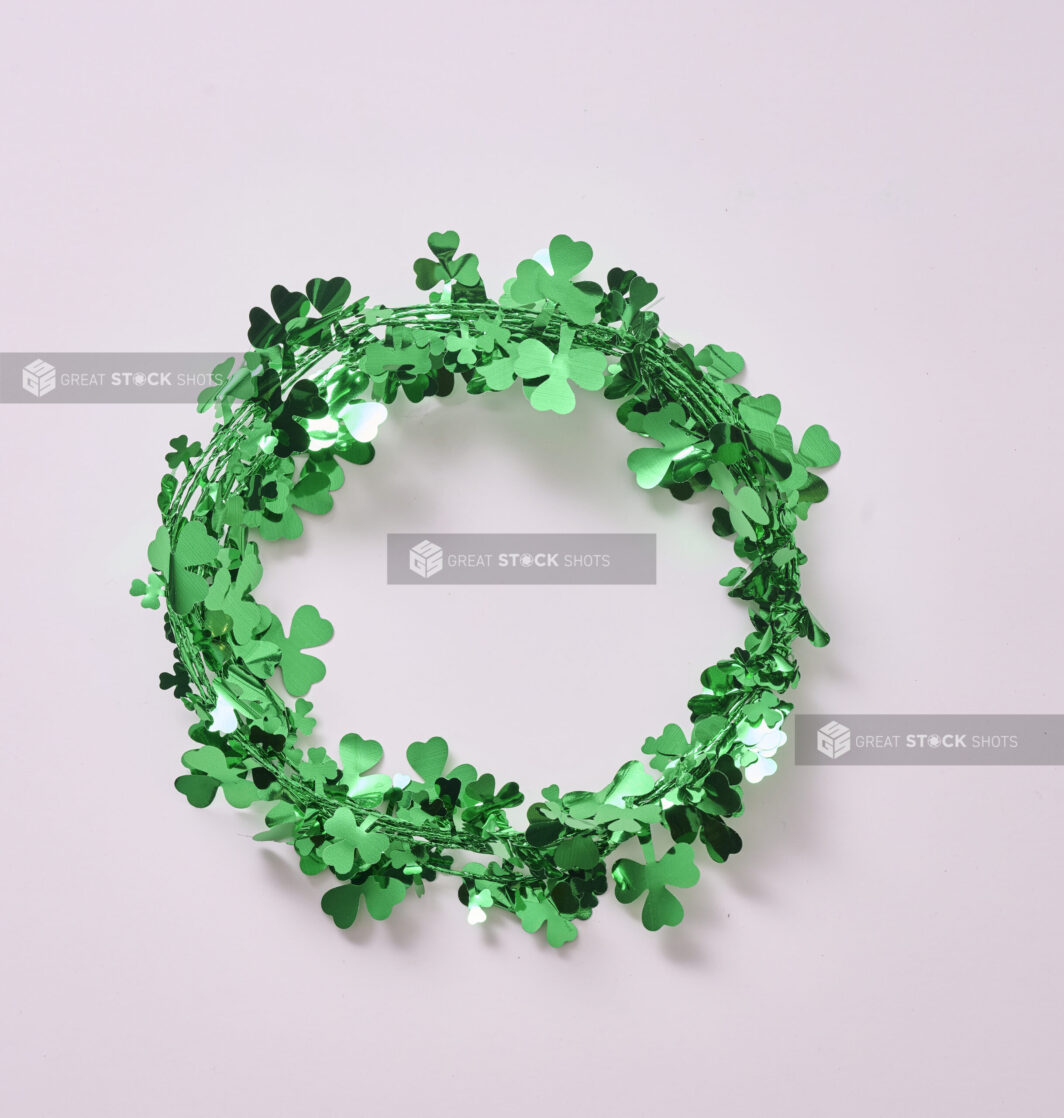 A Metallic Green Clover Wreath/Shamrocks Garland for St. Patrick's Day Decorations, Shot on White for Isolation