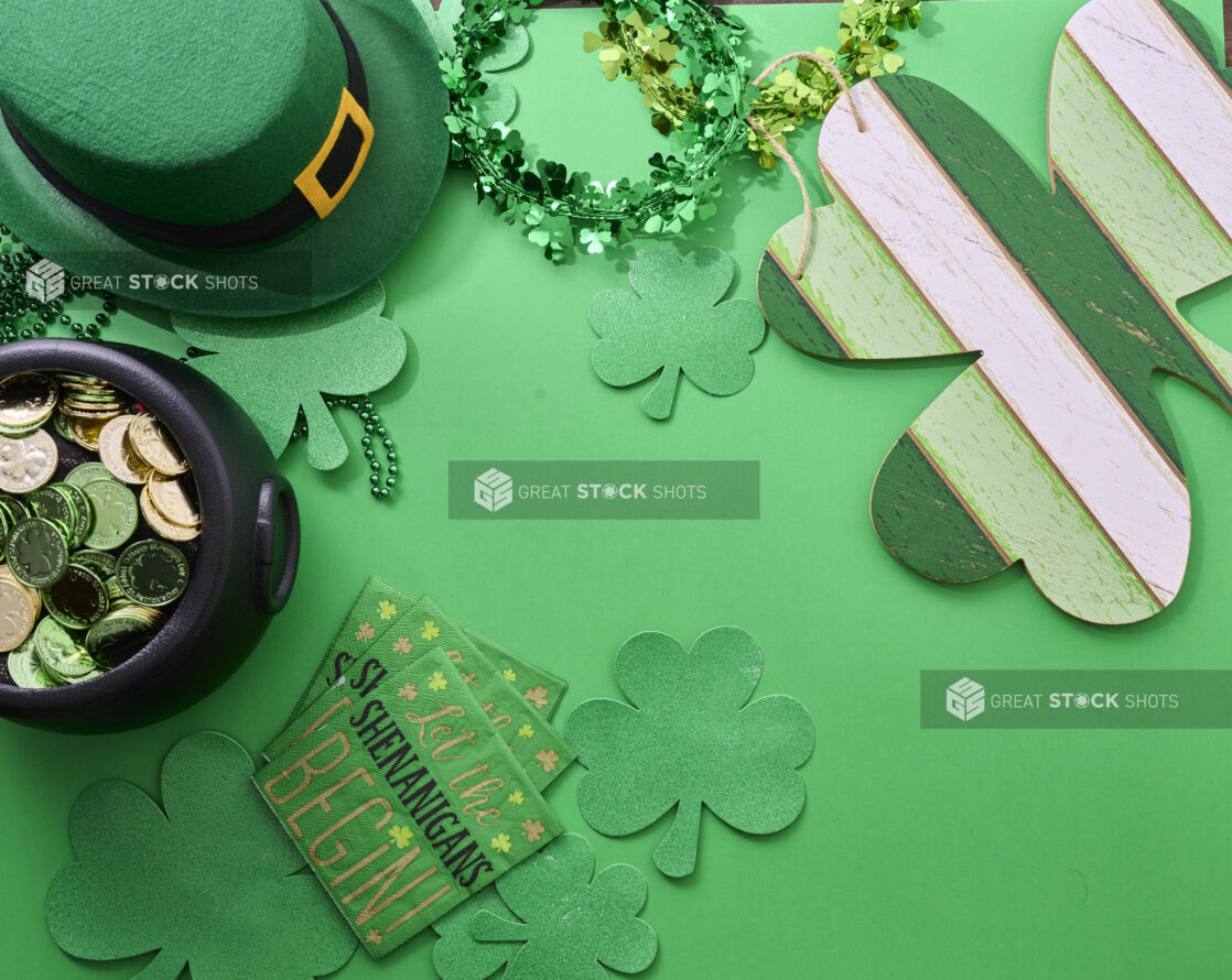 Overhead View of Assorted St. Patrick’s Day Decorations on a Green Background