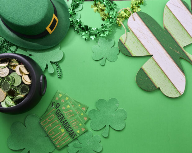 Overhead View of Assorted St. Patrick’s Day Decorations on a Green Background