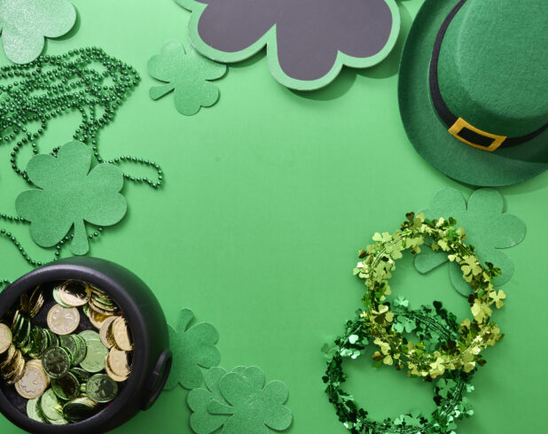 Overhead View of Assorted St. Patrick’s Day Decorations on a Green Background – Variation 2